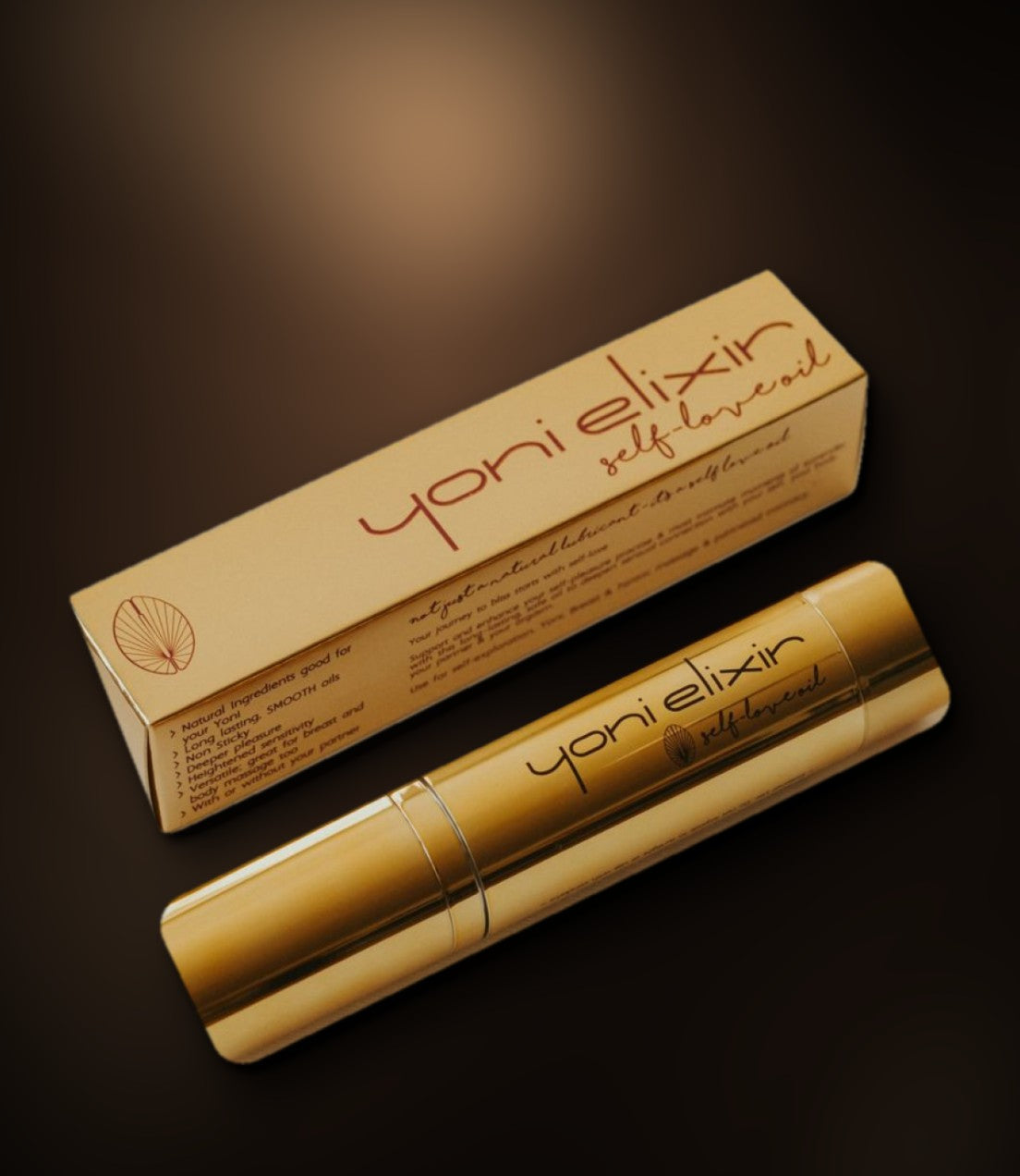 The gold Yoni Elixir bottle and box on dark silk
