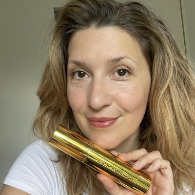 Customer holding her Yoni Elixir bottle