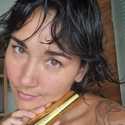 Customer holding her Yoni Elixir bottle