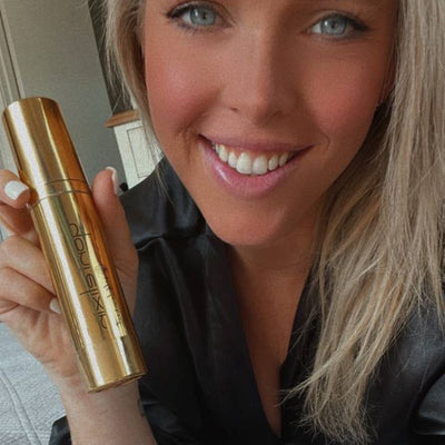 Customer holding her Yoni Elixir bottle