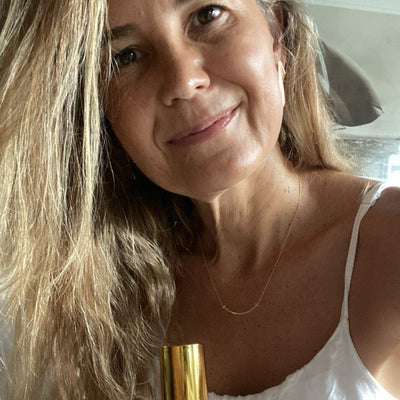 Customer holding her Yoni Elixir bottle