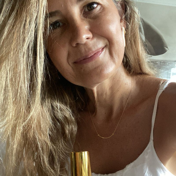 A Yoni Elixir customer with her bottle