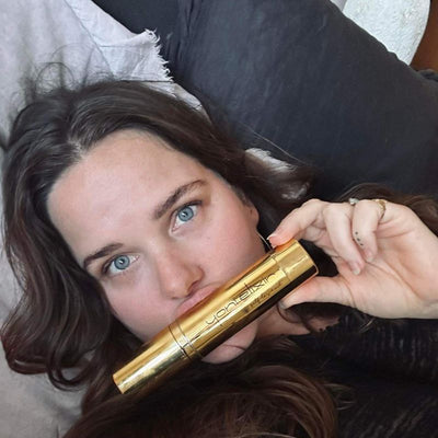 Customer holding her Yoni Elixir bottle